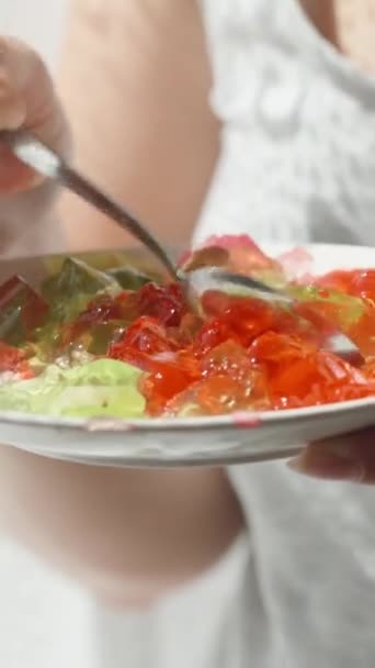 Young Woman Sun Holds Plate Red Green Jelly She Chooses — Stock Video