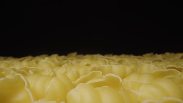 Dry Pasta Laid Out Even Layer Table Black Background Dolly — Stock Video