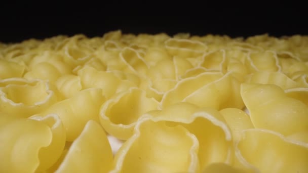 Dry Pasta Gnocchetti Scattered Table Even Layer Camera Slides Forward — Stock Video