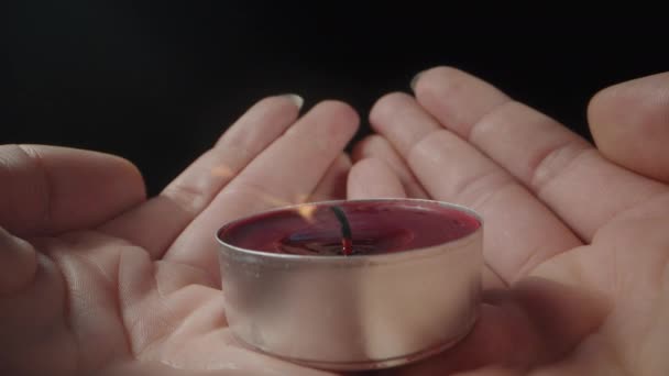 Young Woman Holds Red Candle Her Palms Blows Out Close — Stock Video