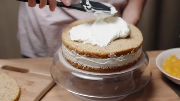 Pastry Chef Shown Slow Motion She Spreads White Cream Sponge — Stock Video