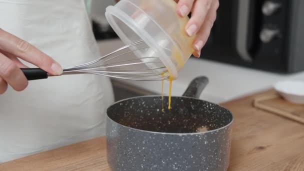 Cook Slowly Pours Egg Yolk Saucepan — Stock Video