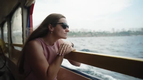 Young Woman Leans Ship Railing Gazes Out Sea Scene Slow — Stock Video