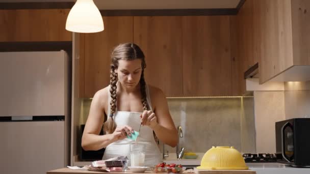 Young Woman Braided Hair Wearing White Apron Preparing Strawberries Chocolate — Stock Video
