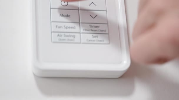 Woman Turns Air Conditioner Decreases Temperature White Remote Control Close — Stock Video