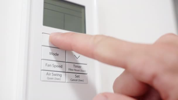 Camera Zooms White Air Conditioner Remote Control Man Decreases Temperature — Stock Video