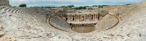 Panorama from the Top of the Ancient Amphitheater, Columns, and Stone Statues Below. Hierapolis