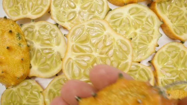 Sliced Pieces Kiwano Cucumbers Seen Top Hold Close Spiky Fruit — Stock Video