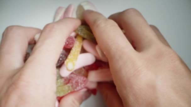 Top View Take Handful Assorted Differently Shaped Mix Gummy Candies — Stock Video