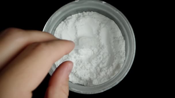 Jar White Powder Black Background Scoop Some Measuring Spoon Sports — Stock Video