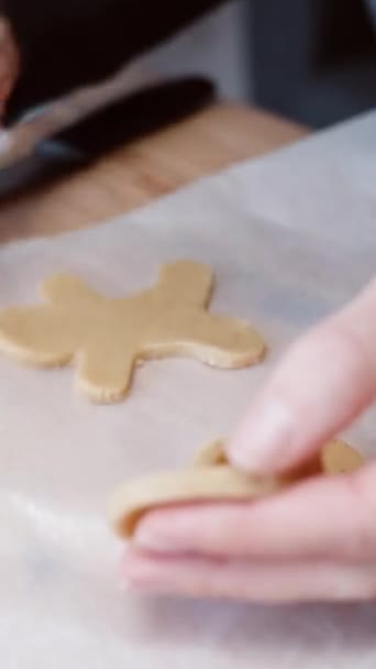 Vertical Video Woman Transfers Candy Cane Shaped Gingerbread Dough Baking — Stock Video
