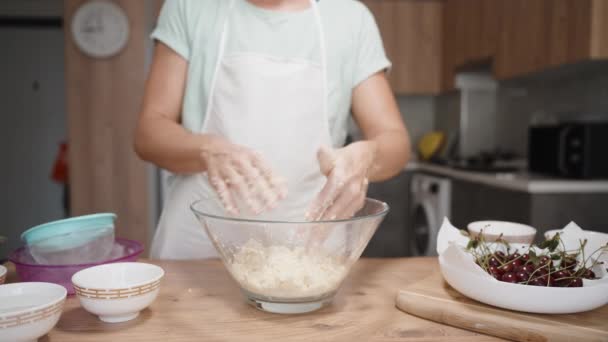 Woman Kneading Dough Glass Bowl Cherry Galette Background Modern Kitchen — Stock Video