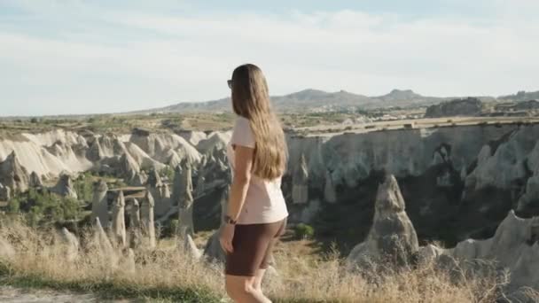 Young Woman Walks Summit Love Valley Camera Follows Her Side — Stock Video