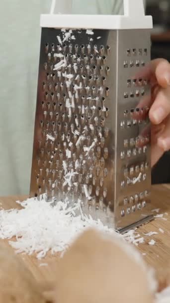 Vertical Video Woman Grated Coconut Shavings Using Metal Grater She — Stock Video