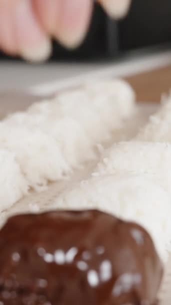 Video Vertikal Coconut Candy Drizzled Chocolate Sprinkled Crushed Hazelnuts Close — Stok Video