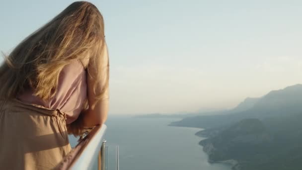 Cinematic Breathtaking View Sea Mountains Young Woman Leans Railing Looks — Stock Video