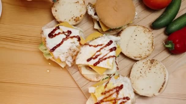 Overhead View Homemade Burgers Woman Finishes Preparing Them Places Top — Stock Video