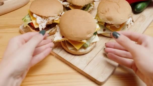 Wooden Table Homemade Burgers Woman Reaches Out Both Hands Takes — Stock Video