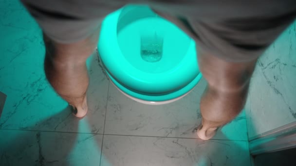 View Man Legs Stands Front Toilet Urinates Blue Light — Stock Video