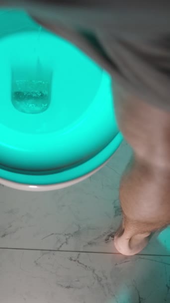 Vertical Video View Man Legs Stands Front Toilet Urinates Blue — Stock Video