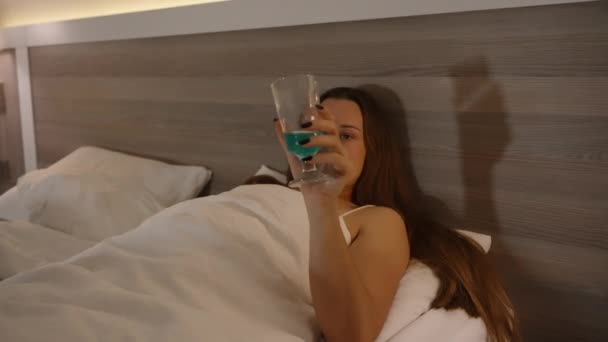 Lonely Woman Pastels Hotel Room Watches Sips Cocktail Approach Closer — Stock Video