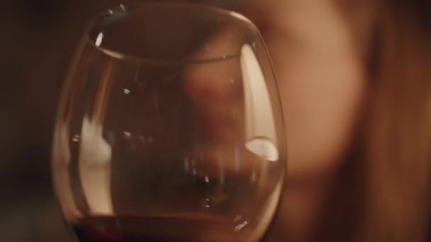 Close Glass Red Wine Woman Swirls Sips Cinematic Lighting Frame — Stock Video
