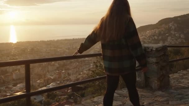 Woman Walks Road Mountain Holding Railing Follow Her Backdrop Sunset — Stock Video