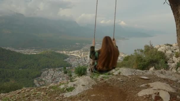 Experiencing Extreme Sensations Young Woman Swings Swings Edge Cliff Overlooking — Stock Video