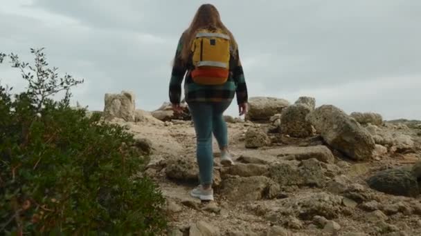 Camera Follows Woman Backpack Journey Adventure She Climbs Rocky Hill — Stock Video