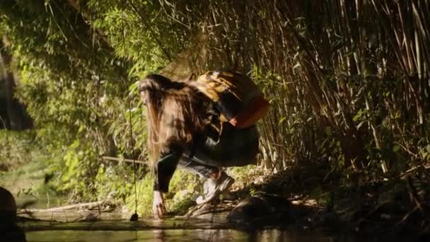 Journey Woman Backpack Bamboo Forest River She Washes Her Hands — Stock Video