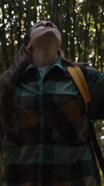 Vertical Video Young Woman Backpack Joyfully Spins Gazing Upward Amidst — Stock Video