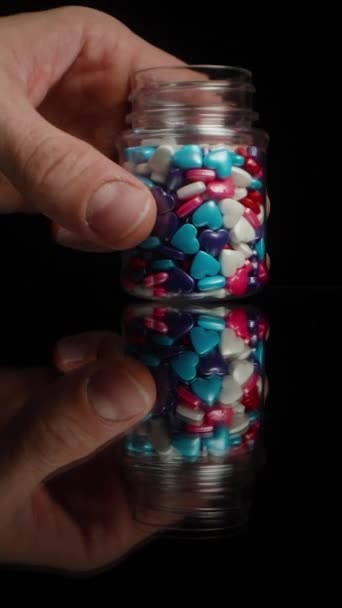 Vertical Video Jar Confectionery Decorations Form Multicolored Sugar Hearts Scatters — Stock Video