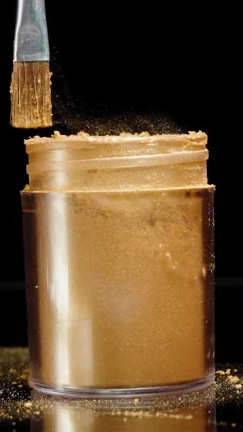 Vertical Video Shaking Brush Golden Powder Jar Particles Golden Dust — Stock Video