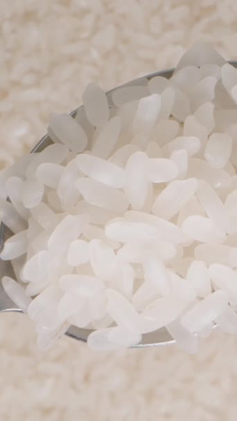 Vertical Video White Rice Grains Metal Spoon Viewed Background Rice — Stock Video