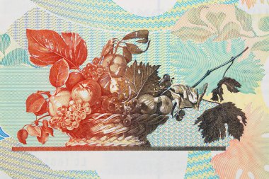 Fruit basket, famous painting by Caravaggio on the back of a vintage lire banknote, graphic engraving