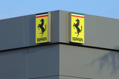 Italy, year 2023, Ferrari cars logo on the building of an official dealer of the brand