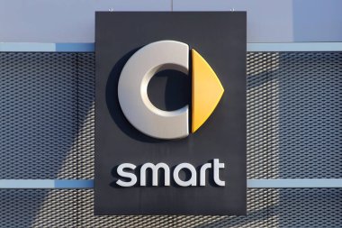 Italy, year 2023, Smart automotive car industry brand, illuminated sign on the building of an official dealer