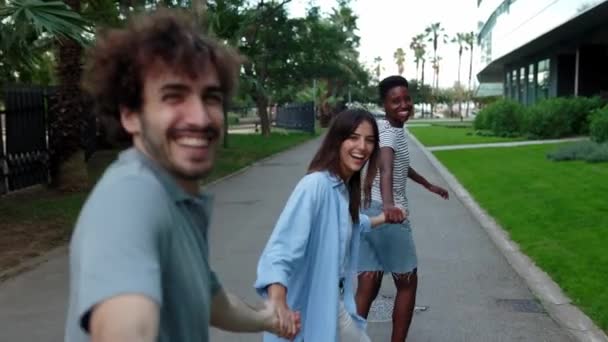 Multiethnic Group Young Friends Running Happily Together While Holding Hands — Stock Video