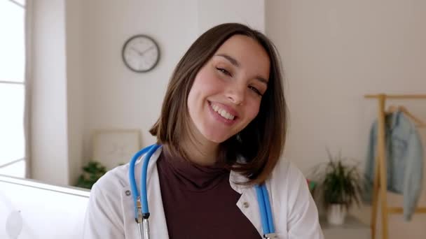 Smiling Portrait Young Female Doctor Standing Consultation Room Hospital Worker — Stock Video