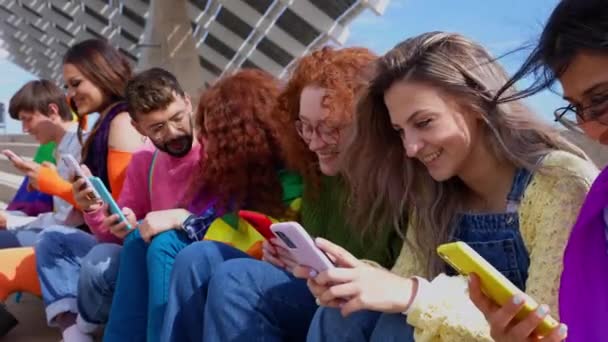 Diverse Young Lgbt Friends Using Smartphone Together Outdoors Communication Lgbti — Stock Video