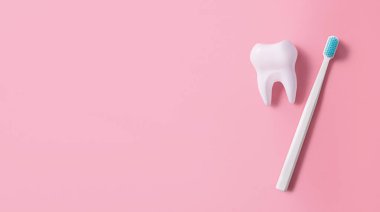 A toothbrush next to a big tooth on a pink background. Oral hygiene. Flat lay, top view, banner. Copy space.