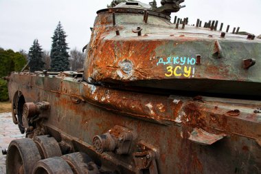 A broken Russian tank with the inscription 