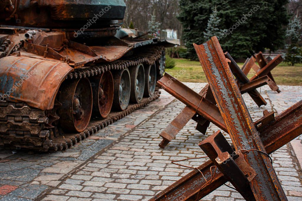 Antitank hedgehogs and broken Russian tanks. Display of the destroyed