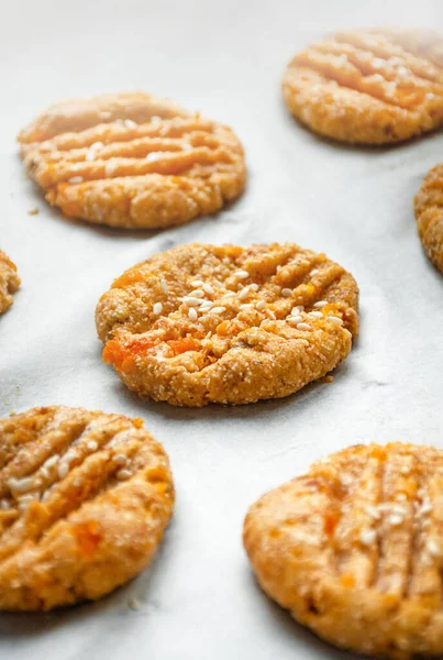 stock image Cooking homemade cookies from oatmeal, banana and dried apricots. Diet cookies on parchment. A healthy snack. Proper nutrition.