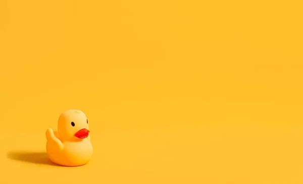 Rubber Duck Swimming Yellow Background Children Toy Banner Copy Space — Fotografie, imagine de stoc