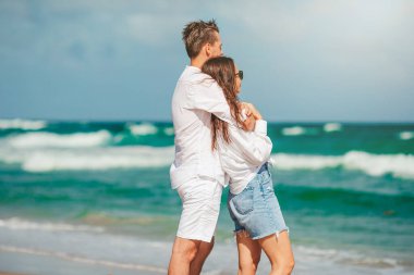 Romantic couple in love walking on the beach on romantic honeymoon travel