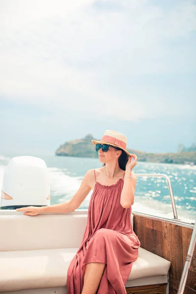Luxury trip on the boat. Beautiful woman enjoying luxury yacht cruise. High quality photo