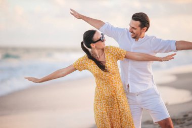 Romantic couple in love walking on the beach on romantic honeymoon travel
