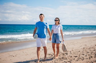 Romantic couple in love walking on the beach on romantic honeymoon travel