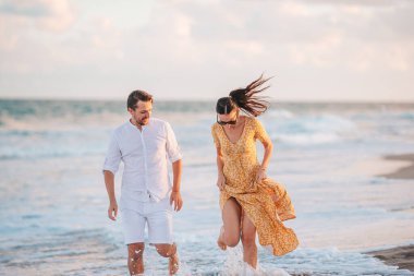 Romantic couple in love walking on the beach on romantic honeymoon travel